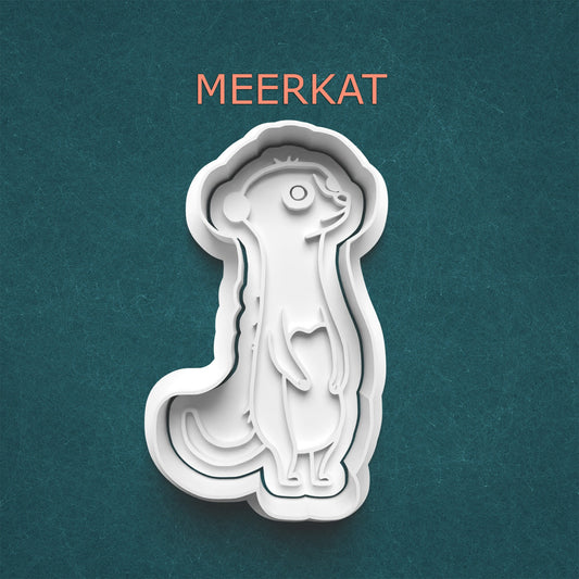 Meerkat-shaped cookie cutter on a teal background with 'MEERKAT' text.