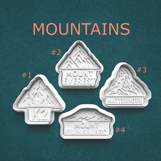 Four mountain-themed cookie cutters with names on a teal background