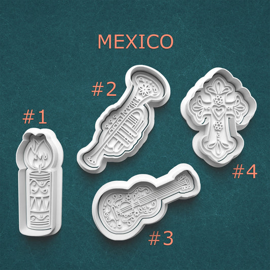 Set of four decorative molds with Mexican designs on a teal background