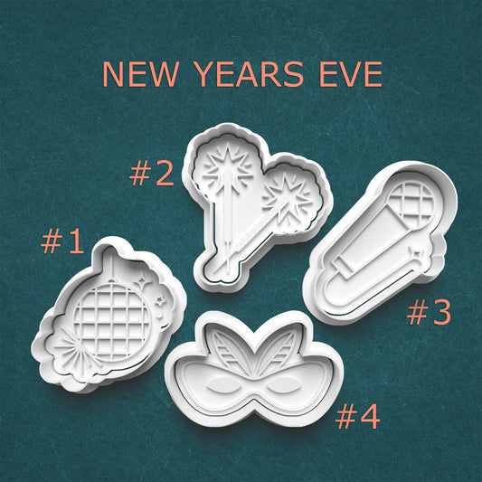 Four New Year's Eve-themed cookie cutters on a teal background