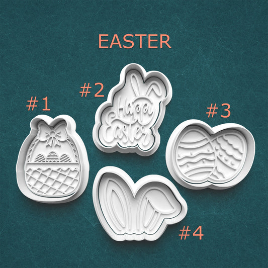 Set of four Easter-themed cookie cutters on a teal background
