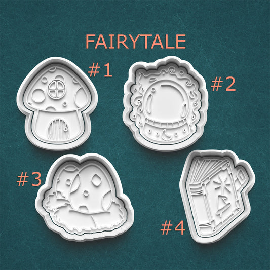 Four fairytale-themed cookie cutters on a teal background