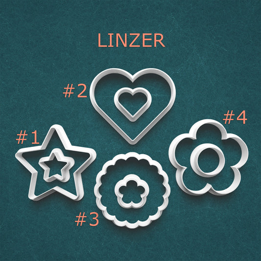 Set of Linzer cookie cutters with shapes and numbers on a teal background