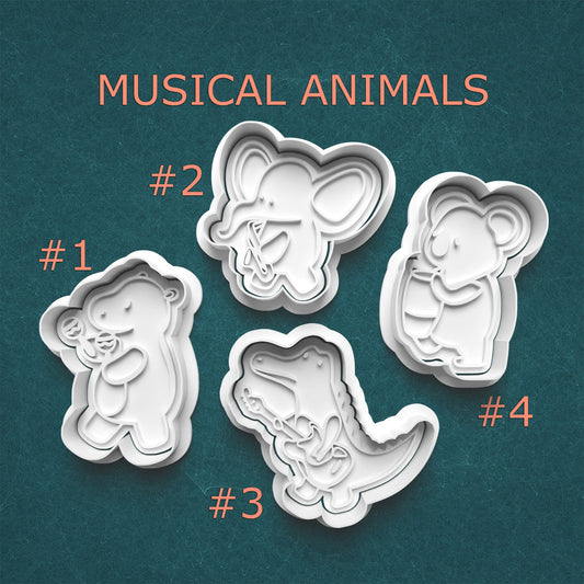 Set of four cookie cutters shaped like musical animals on a teal background with text 'Musical Animals'.