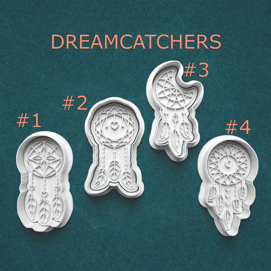 Four white dreamcatcher cookie cutters on a teal background with 'Dreamcatchers' text above.