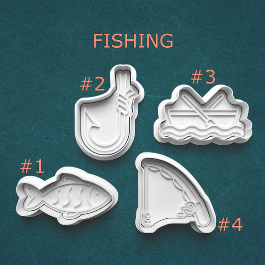 Set of four fishing-themed cookie cutters on a teal background