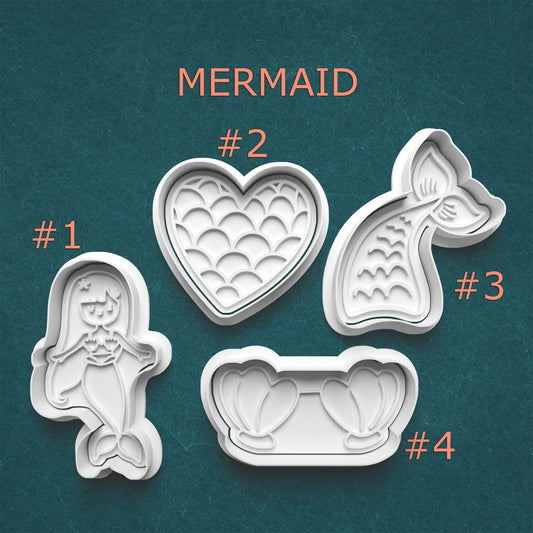 Set of four mermaid-themed cookie cutters on a teal background