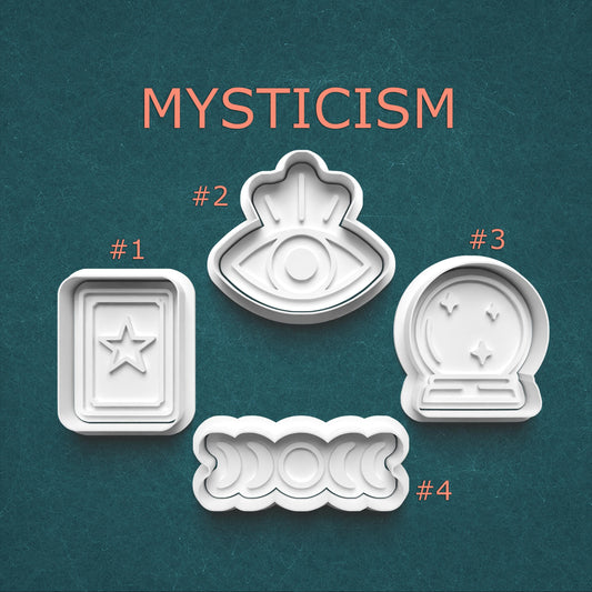 Set of four white cookie cutters with mystical designs on a teal background, labeled 'Mysticism'.