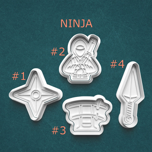 Set of four ninja-themed cookie cutters on a teal background