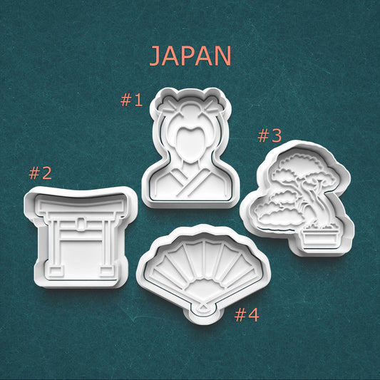 Set of cookie cutters shaped like traditional Japanese elements on a teal background with 'Japan' text.