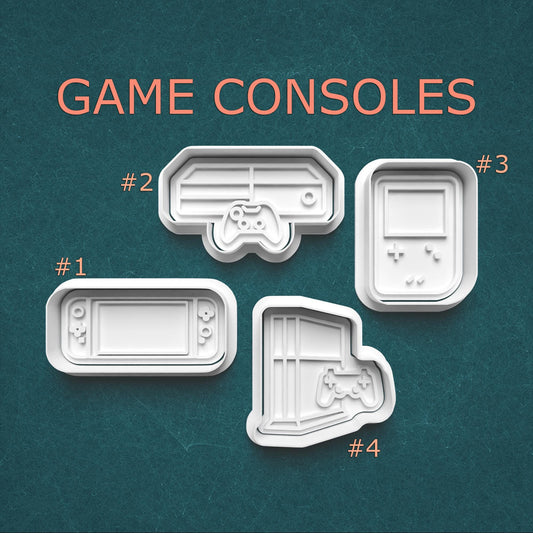 Four different designs of game console-shaped cookie cutters on a teal background with 'GAME CONSOLES' text.