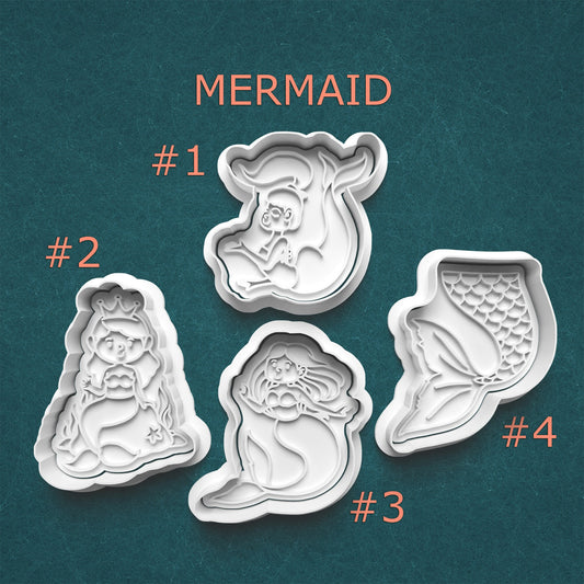 Set of four mermaid-themed cookie cutters on a teal background