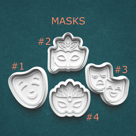 Set of four mask-shaped cookie cutters on a teal background with 'MASKS' text above.