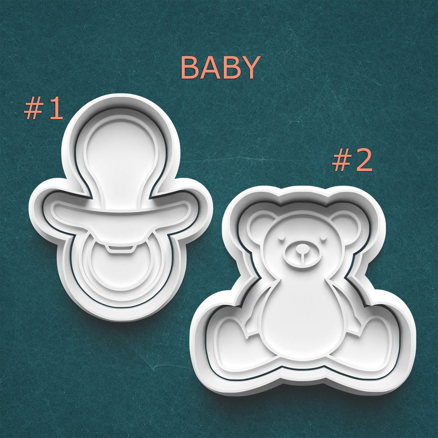 Two cookie cutters shaped like a baby and a teddy bear on a teal background.