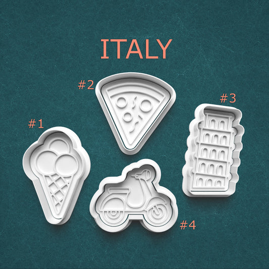 Set of cookie cutters shaped like an ice cream cone, pizza slice, scooter, and leaning tower on a teal background with 'ITALY' text.
