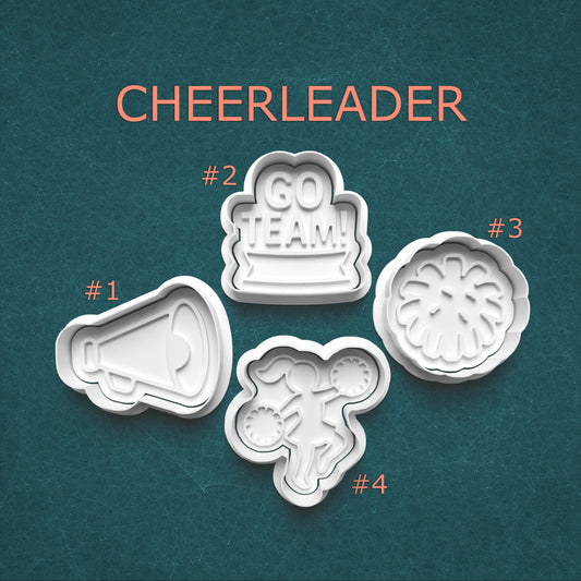 Set of four cheerleader-themed cookie cutters on a teal background with 'CHEERLEADER' text.