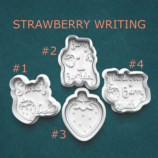 Set of strawberry-themed cookie cutters with text on a teal background