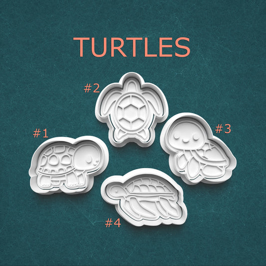 Four turtle-shaped cookie cutters on a teal background with 'TURTLES' text above.