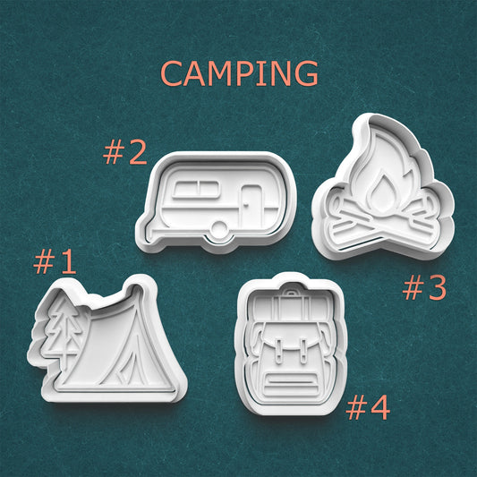 Set of four camping-themed cookie cutters on a teal background with 'Camping' text above.