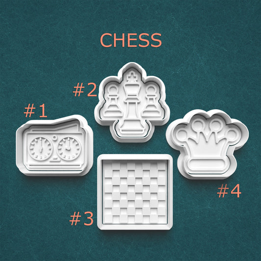 Set of four cookie cutters shaped like chess pieces and board on a teal background.