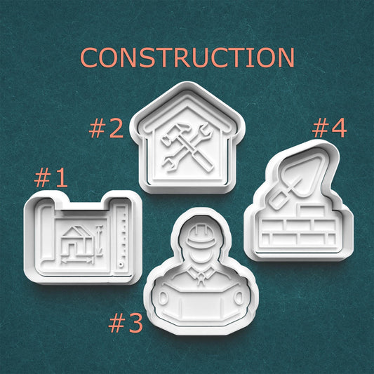 Four construction-themed cookie cutters on a teal background with 'CONSTRUCTION' text above.