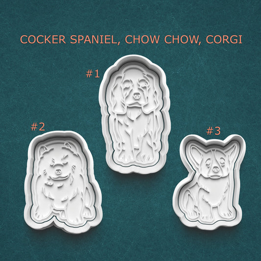 Three dog-shaped cookie cutters on a teal background with text indicating the breeds.
