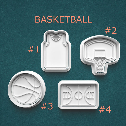 Basketball-themed cookie cutters on a green background