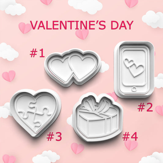 Valentine's Day cookie cutters on a pink background with hearts and clouds.