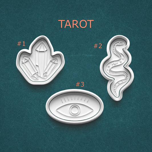 Three tarot card design elements on a teal background with 'Tarot' text above.
