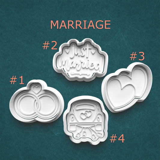 Set of cookie cutters with marriage-themed designs on a teal background