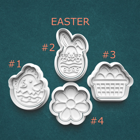 Set of four Easter-themed cookie cutters on a teal background