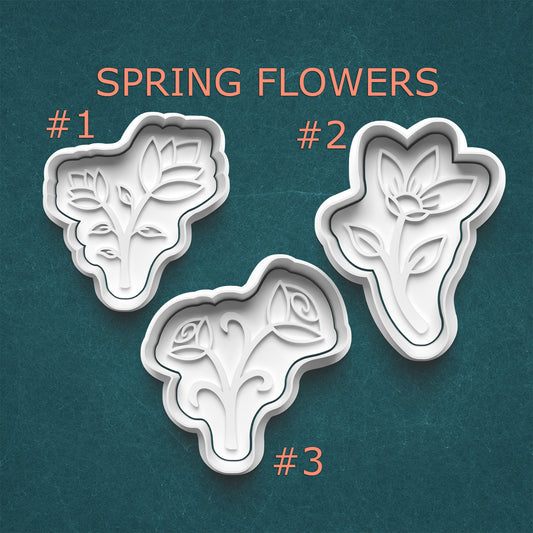 Three spring flower-shaped cookie cutters on a teal background with 'Spring Flowers' text above.