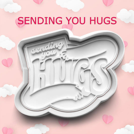 Cookie cutter with 'sending you hugs' text on a pink background with hearts and clouds