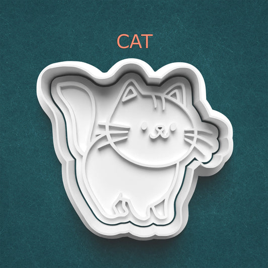 Cat-shaped cookie cutter on a teal background with 'CAT' text above.