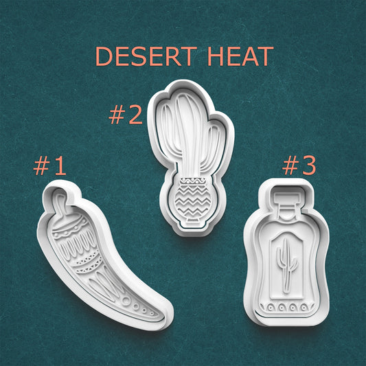 Three cookie cutters with desert-themed designs on a teal background, labeled 'Desert Heat'.