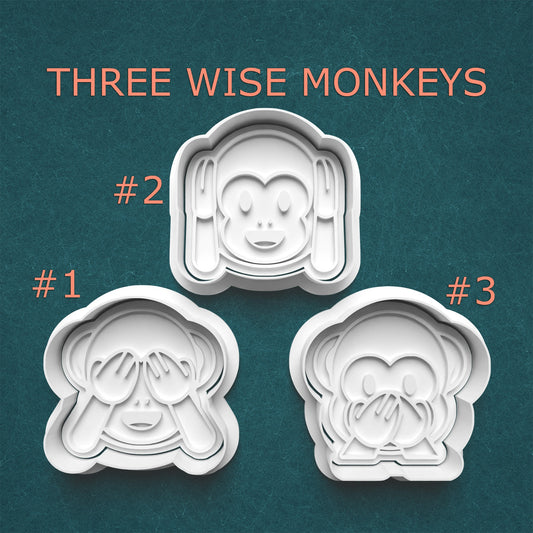 Three monkey-themed cookie cutters with 'Three Wise Monkeys' text on a teal background.