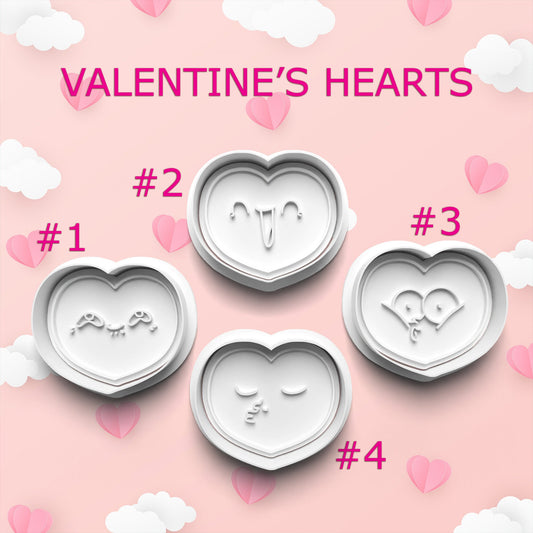 Heart-shaped cookie cutters with designs on a pink background with hearts and clouds.