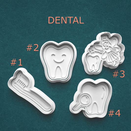 Set of dental-themed cookie cutters on a teal background