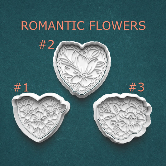 Three heart-shaped cookie cutters with floral designs on a teal background, labeled '#1', '#2', and '#3'.