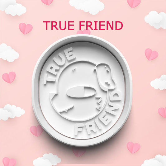 White 'True Friend' cookie cutter on a pink background with hearts and clouds