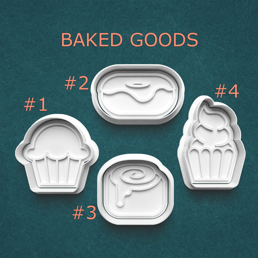 Set of four cookie cutters shaped like baked goods on a teal background with 'BAKED GOODS' text.