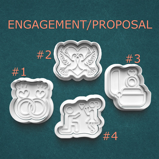 Set of four engagement/proposal themed cookie cutters on a teal background