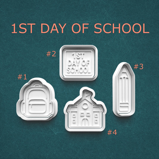 Four cookie cutters with '1st Day of School' text on a teal background