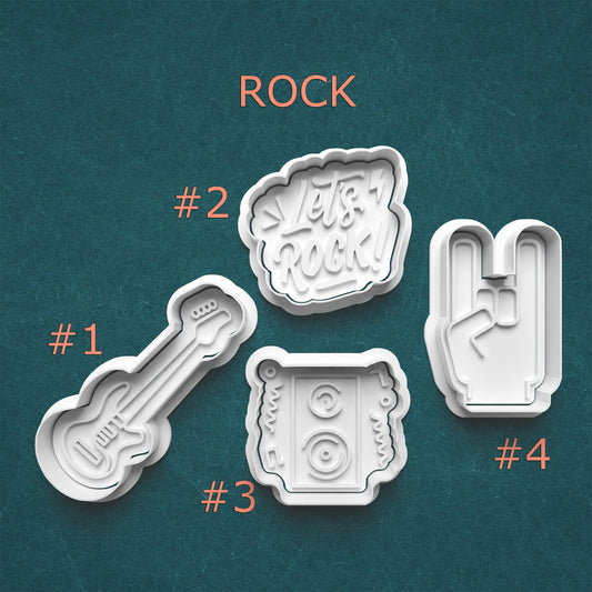 Set of four cookie cutters with rock-themed designs on a teal background