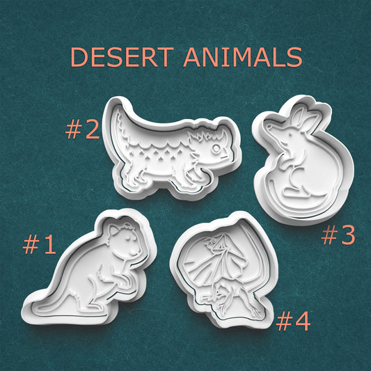 Set of desert animal-themed cookie cutters on a teal background with text indicating 'Desert Animals'.