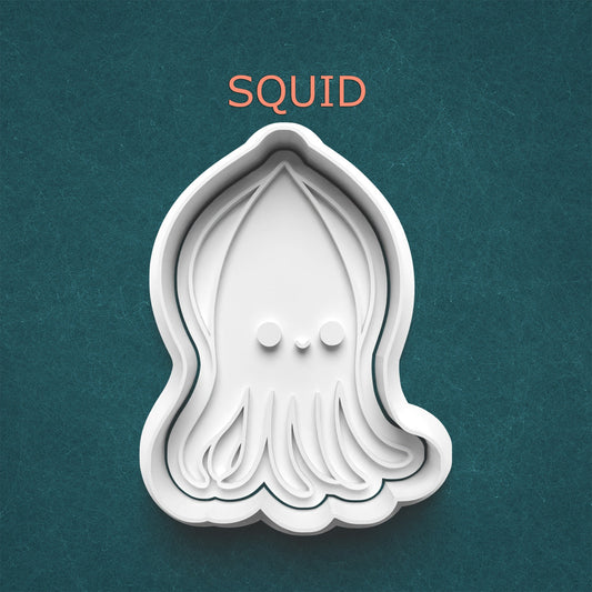 Squid-shaped cookie cutter on a teal background with 'SQUID' text above.
