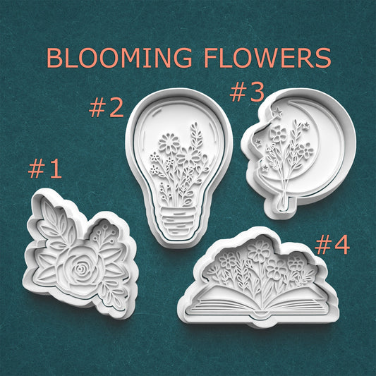 Set of four floral cookie cutters with designs on a teal background