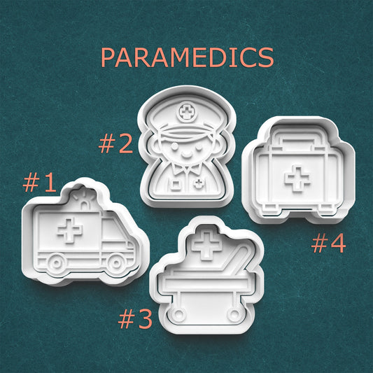 Set of four cookie cutters shaped like paramedics on a teal background