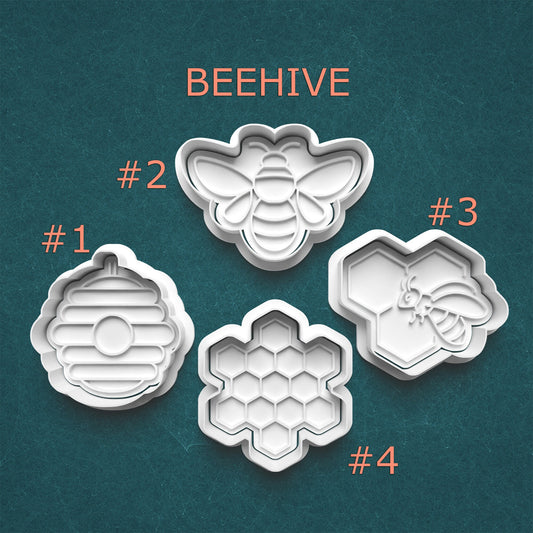 Set of four bee-themed cookie cutters labeled #1 to #4 on a teal background.