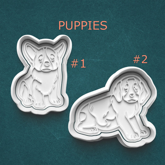 Two dog-shaped cookie cutters on a teal background with 'Puppies' text above.